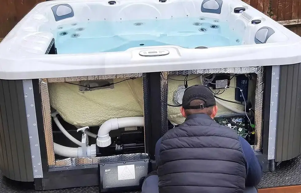 person serciving a hot tub